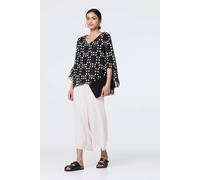 Izabel London Dot Print Semi Sheer Flare Sleeve Blouse for Women UK with a v-Neck and a Curve Layered Hem. Black