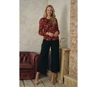 Izabel London Printed Semi Sheer Long Sleeve Blouse for Women UK with a Keyhole Back and a Pleated Texture. Orange