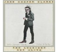 John Cooper Clarke The Luckiest Guy Alive Paperback Book in White John Cooper Clarke White