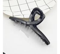 Large black hair clip with a simple and versatile design, featuring a shark shaped headband at the back of the head