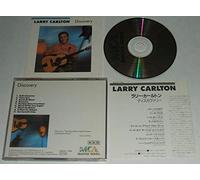 LARRY CARLTON. DISCOVERY. 1987 UNBARCODED 9 TRACK CD ALBUM MADE IN JAPAN. MCA 32XD-766.