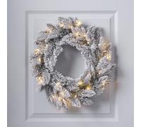 Lights4fun Pre-Lit Indoor Christmas Wreath made with fluffy faux fir foliage flocked with a snowy effect