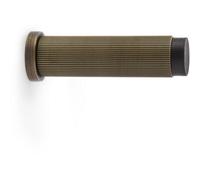 Loops Rubber Tip Reeded Wall Mounted Doorstop - Antique Brass 75mm Cylinder Lined Door