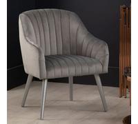 luxury upholstered velvet armchair with silver legs in grey