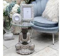Madison & Mayfair Silver Sitting Buddha Side Table With A Clear Glass Top