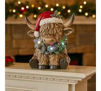 Marco Paul Christmas Highland Cow LED Ornament - 14 cm Free-Standing Light-Up Resin Figure with Multi-Coloured LED Wreath - Battery Powered Festive Xmas Decoration for Indoor Christmas Displays
