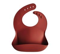 mushie Baby Silicone Bib | Adjustable Fit Waterproof Bibs | Easy Wipe Baby Feeding Bibs | 4 Adjustable Sizes with Deep Front Pockets | 100% BPA and Phthalate Free (Raw Sienna)