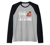 My Wife Isnt Fragile Like A Flower She is Like a Bomb Raglan Baseball Tee