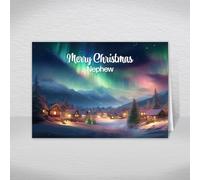Nephew Christmas Card - Snowy Village Design, A5 | Snowy Christmas village beneath the Northern Lights design