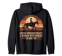 NEVER UNDERESTIMATE A WOMAN WITH HORSES IN HER 70S Riding Zip Hoodie