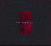 OLD RED CHAIR ON THE PORCH