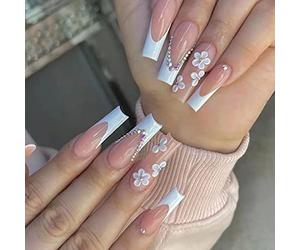 Package Contents:24 pcs false nails,1 piece nail file,1 sheet of double-sided jelly glue stickers. How to Use : 1.File the sides and cuticle are for an accurate fit,clean your nails and wait for then to air dry. 2. Choose the right jelly gule to stick on the nail surface and choose the right size fake nail to stick on the nail. 3. Put on fake nails and press for 5 seconds and sanding the edges is done,please after you wear the false nail try not to get your hands wet at the fisrt few minute. How to Remove: 1.Put your nails in warm water for 2 minutes which will remove nail sticker easier. 2.Do not remove it abruptly which may leave some mark of the nail stickers on your nail surface.In that case,you can also clean the remain nail stickers with water. Note: 1)Try not to get your hands wet the fisrt few minute you wear the false nail. 2)The colors may exist slight difference due to different screens. Feature: Press on nails are made of high quality ABS material,no harm to your nails or body,durable and not easy to fade. 24 pcs french flower false nails in 12 different sizes,no matter what your nail size is,you can choose the most suitable false nail for yourself. You can have beautiful nails in just a few simple steps,3 minutes instead of 30 minutes in nail salon.