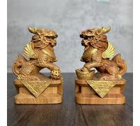 pair of feng shui mascots made of cliff cypress wood, featuring gilded statues of auspicious qilins for wealth, are suitable for gifting collection when opening a home or office. They bring prosperity