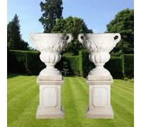 Pair Of Giant Fruit Design Stone Vases On Plinths