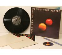 PAUL MCCARTNEY. WINGS. - PAUL McCARTNEY. WINGS. Venus and Mars. COMPLETE WITH 2 POSTERS and TWO STICKERS. Very rare to find with all the inserts. First UK pressing. 1975. Record label: Capitol.