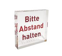 Plexiglas® block as a crystal clear information stand/information stand with red note print "Bitte Abstand halten".