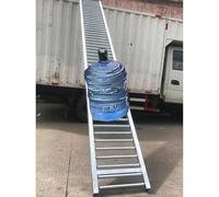 Portable Steel Conveyor Roller Stand 23ft Long Foldable Belt Conveyor Rollers Unpowered Skate Wheels for Freight Handling in Factories 20in Width.