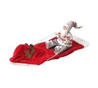 Red Christmas Pet Snuffle Mat with Santa Character and White Plush Trim | A red elongated floor mat has a raised pale border and a small Santa figure attached near one end; shown with cords acros