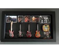 RGM8982 Slash Miniature Guitar Collection includes three mounted replica Slash miniature guitars bass drum in a shadowbox frame. A delightful gift for any GNR fan