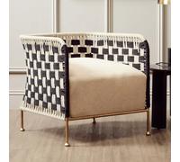 slinger rattan bedroom chair with gold legs in black and white
