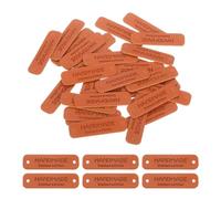 sourcing map 30 Pcs Handmade Leather Labels, PU Leather Handmade Tags Button with Hole Embossed Tag for Embellishment DIY Sewing Crafts, 55x15mm, Brown
