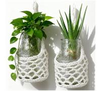 Space-saving plant stands, hand-crocheted openwork kitchen nets, and wall-mounted hanging planters, ideal for decorating the living room, kitchen and bathroom