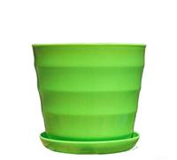 Stylish imitation flower pots with effective drainage holes and trays to protect surfaces, made from recyclable materials for indoor and outdoor plant display (Is green)