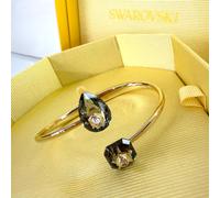 Swarovski Numina Bangle, Contrasting Pear Drop and Imperial Cut Grey Crystals, Gold-tone Plated Band from the Numina Collection, Size M