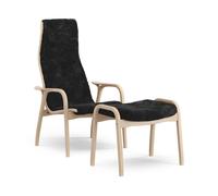Swedese Lamino armchair and footstool varnished beech/sheepskin Black