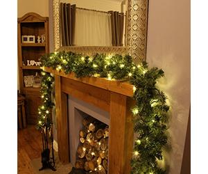 The Magic Toy Shop 9FT Pre-Lit Christmas Garland with Timer - 35 Warm White LED Lights - Battery Operated Artificial Greenery - Indoor & Outdoor Xmas Decoration for Stairs, Fireplace Mantel, Doorway