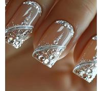 The short square press of the nail adheres to the glittering full covered nails of the French design for an elegant and luxurious look fake