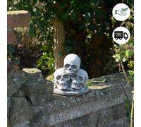 Three Skull Stone cast Garden Ornament
