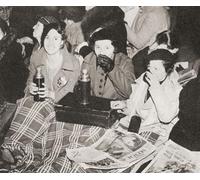 Three women have an early morning cup of tea in Piccadilly Circus London England whilst waiting for the coronation procession of George VI and Queen Elizabeth in 1936. From The Coronation in Pictures