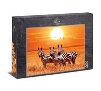 Ulmer Puzzleschmiede - Puzzle "Under the African Sun": 1000 pieces jigsaw puzzle - A small group of zebras under the sun in the savannah in Africa