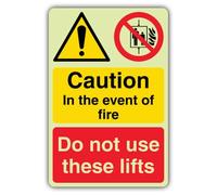 V Safety Glow In The Dark Caution In The Event Of Fire Do Not Use These Lifts Sign - 400 x 600 mm - Made From Double Glow Self Adhesive Vinyl - Fire Safety Signage - Made in Britain