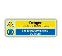 V Safety Glow In The Dark Danger Noise Level Of 85DB Or Above - Ear Protectors Sign - Slim Format - 450 x 150 mm - Made From Triple Glow Rigid Plastic - Hazard Warning Signage - Made in Britain