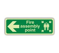 V Safety Glow In The Dark Fire Assembly Point Arrow Left Sign - Slim Format - 750 x 250 mm - Made From Double Glow Rigid Plastic - Fire Safety Signage - Made in Britain