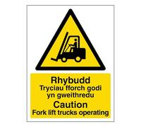 V Safety Welsh/English - Caution Fork Lift Trucks Operating 300 x 400 mm - Self Adhesive Vinyl Safety Sign