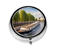 View of The Seine A Round Mini Pillbox with Three Compartments for Storing Vitamins, Fish Oil, and Nutritional Supplements.