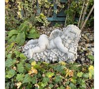 Vintage Cherub Statue Laying On A Grape