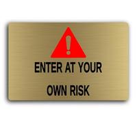 Warning sign indicating potential danger or hazards, advising people to enter at their own risk. Sign - 29.0x19.0cm Brushed Aluminium