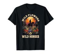 western sunset cowgirl riding horse wild flowers wild horses T-Shirt
